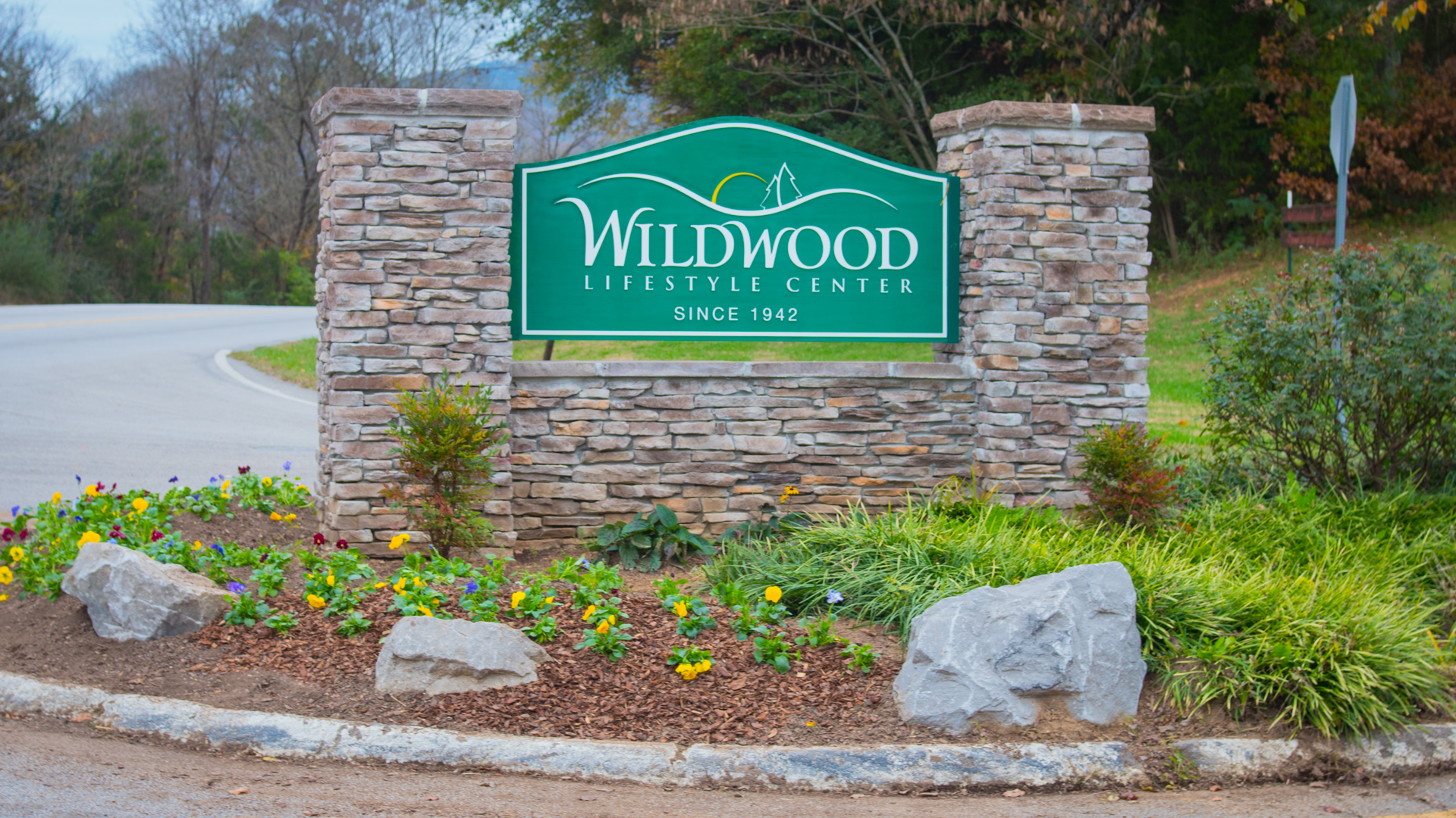 Wildwood Lifestyle Center stone entrance sign, established 1942