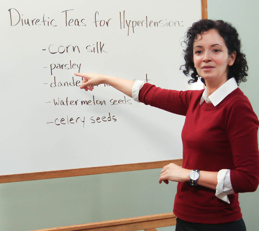 Educator teaching a natural-remedies health lecture at Wildwood